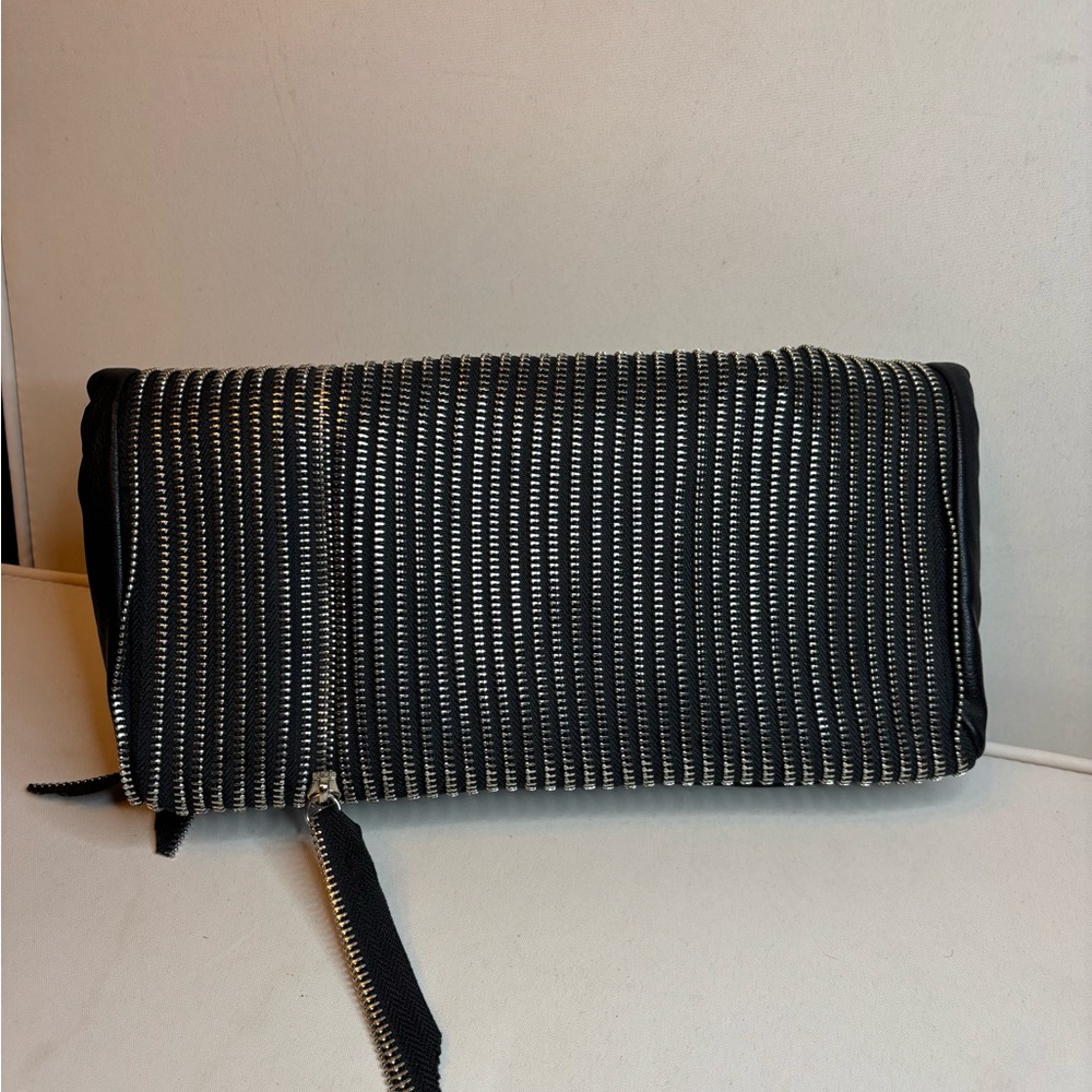Unique Black Clutch with multi zipper detailing.